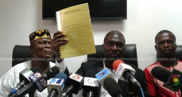 Duncan Amoah with a copy of the petition forwarded to the Special Prosecutor.