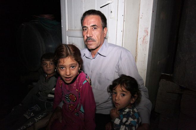 Khalid Taalo Khudhur al-Ali with nephews and nieces who also made it to safety in August 2014