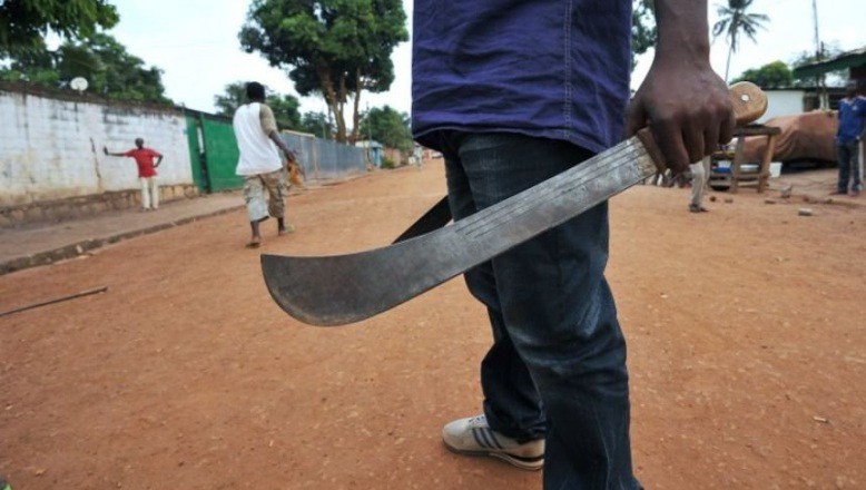 man holding knife to butcher