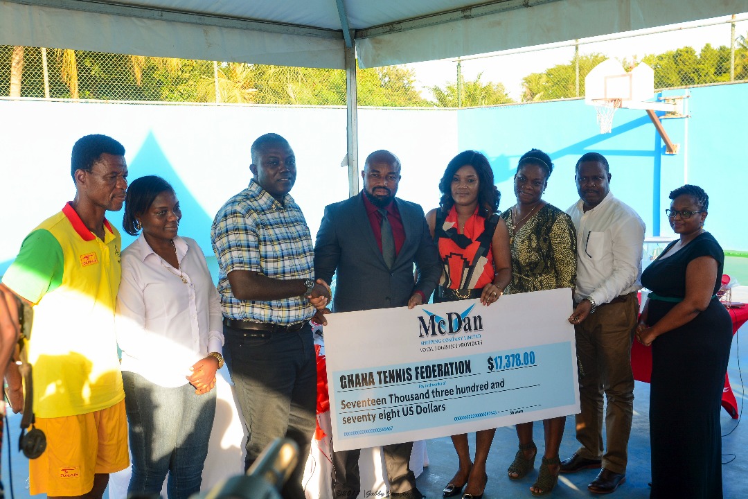 Aboagye-Duah (3rd from left) in a handshake with Dr. McKorley. With them are Mrs. Abigail McKorley (5th from left) of McDan and GTF officials