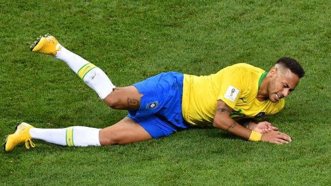 Brazil's forward Neymar falls down during the Russia 2018 World Cup quarter-final. (Source :AFP)