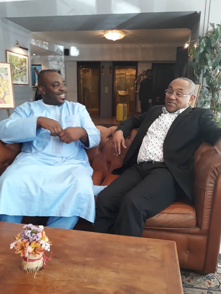 Isaac Asiamah chatting with CAF Ahmad Ahmad