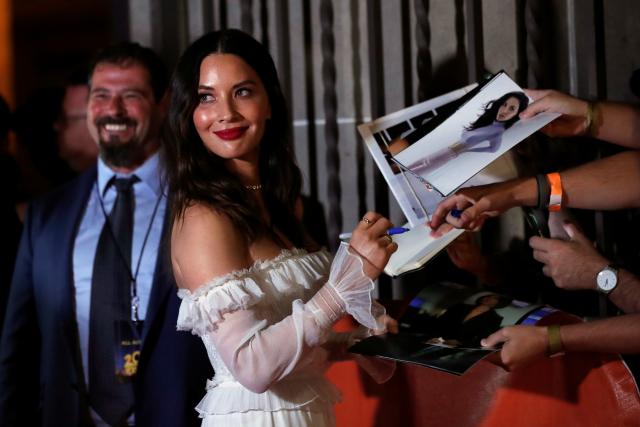 Olivia Munn signs autographs at the premiere of The Predator.REUTERS/Mario Anzuoni