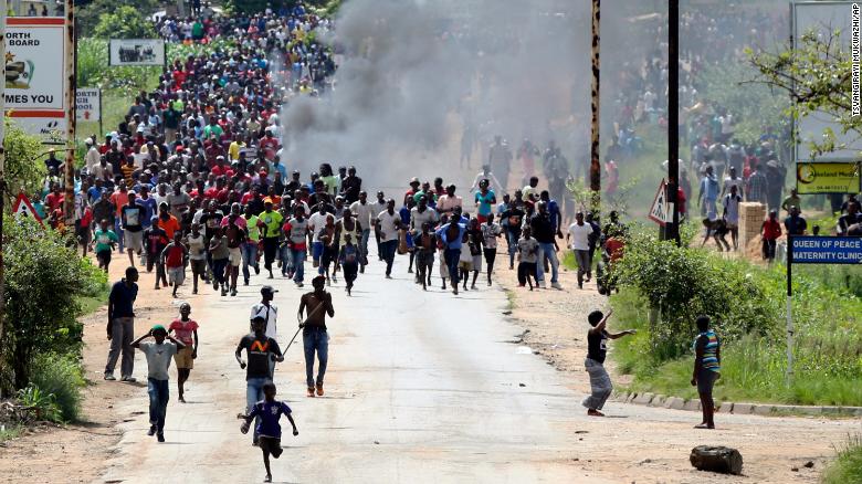 Protestors gather  on the streets  during demonstrations over the hike in  fuel prices in Harare, Zimbabwe, Monday, Jan,14, 2019.Zimbabwean President Emmerson Mnangagwa in an address  Saturday more than doubled the price of gasoline hoping the  increase will end severe shortages that are fueling public anger even  as he departs on a foreign trip to  Russia and  other countries in search of  investment.(AP Photo/Tsvangirayi Mukwazhi)