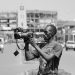 A journalist at work with his camera. Wikimedia Commons
