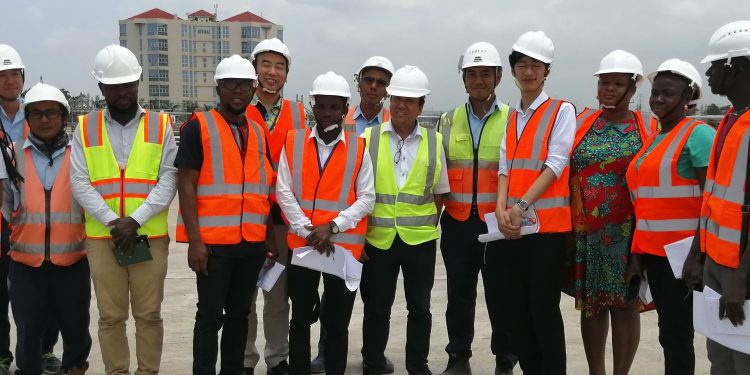 Journalists, JICA officials and some staff of Shimizu-Dai Nippon JV at the Tema Motorway Roundabout during the tour.