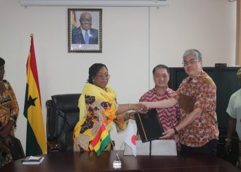 JICA's Chief Representative, Mr. Hirofumi Hoshi and Ghana's Foreign Minister at the signing ceremony.