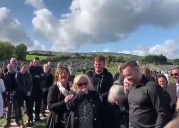 Mourners laugh as Shay Bradley's voice can be heard from beyond the grave