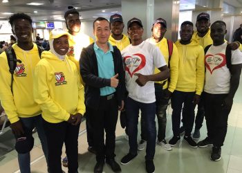 Mr. Isaac Hu with Rafatu Inusah, Tournament Manager, and Ghana Men’s VIIs Squad.