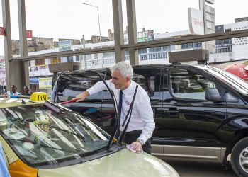 Managing Director of Total Ghana, Eric Fanchini serving a customer.
