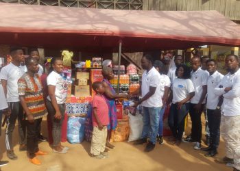 Executive Director of Springoh Charity Foundation, Abraham Tucker, leads his team to make the donation.