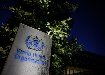 A photo taken in the late hours of May 29, 2020 shows a sign of the World Health Organization (WHO) at their headquarters in Geneva amid the COVID-19 outbreak, caused by the novel coronavirus. - President Donald Trump said May 29, 2020, he was breaking off US ties with the World Health Organization, which he says failed to do enough to combat the initial spread of the novel coronavirus. (Photo by Fabrice COFFRINI / AFP) (Photo by FABRICE COFFRINI/AFP via Getty Images)
