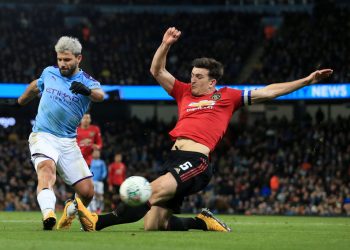 MANCHESTER, ENGLAND - JANUARY 29: Harry Maguire of Man Utd tries to block a shot from Sergio Aguero of Man City during the Carabao Cup Semi Final match between Manchester City and Manchester United at the Etihad Stadium on January 29, 2020 in Manchester, England. (Photo by Simon Stacpoole/Offside/Offside via Getty Images)