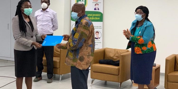 Acting WR, Dr Neema Rusibamayila Kimambo, handing over the official letter to the Minister of Health, Hon. Kwaku Agyemang-Manu