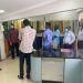 Mr. Kofi Sekyere,(second from left) briefs journalists about the range of products supplied by the company as Mr. Isaac Kyei-Mensah (extreme left) looks on.
