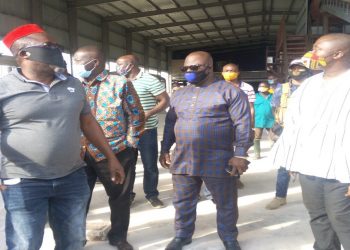 MR. BOATENG (IN RED CAP) TAKING THE DIGNITARIES ROUND THE FACILITY