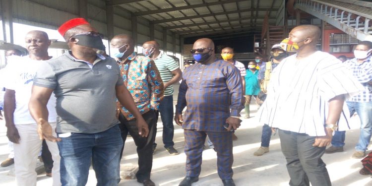 MR. BOATENG (IN RED CAP) TAKING THE DIGNITARIES ROUND THE FACILITY