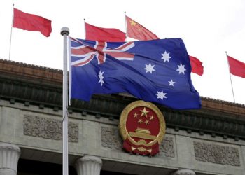 FILE PHOTO: An Australian flag flutters in front of the Great Hall of the People during a ceremony in Beijing, China, April 14, 2016. REUTERS/Jason Lee