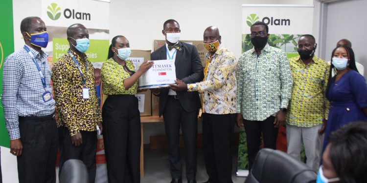 Miss Mantey hands over a package of PPEs to the Deputy Minister for Health.