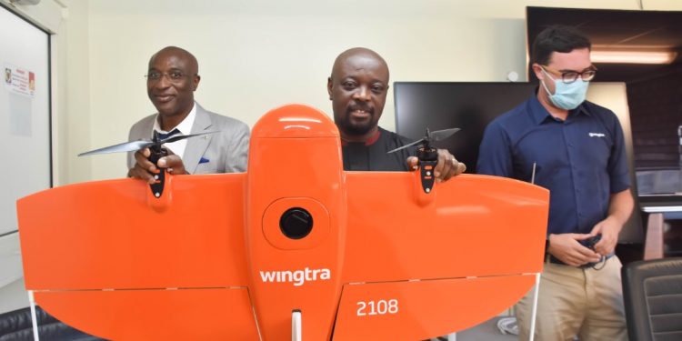 MD of ECG, Kwame Agyeman-Budu [middle] showing the Drone to the audience
