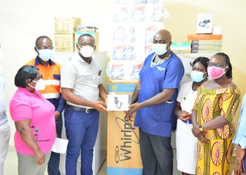 Dr Annor (left) presenting items to Medical Superintendent (right)