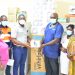 Dr Annor (left) presenting items to Medical Superintendent (right)