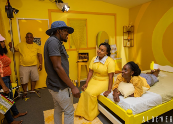 Aloe Vera director Peter Sedufia (L) on the set of his hit film