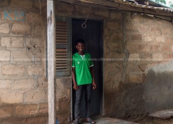 Ali in front of the home he lived in for over 18 years