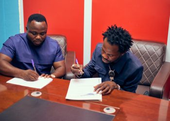 CEO of The Makers Electronics, Stephen Essoun, signing the deal with Fameye.