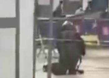 Video circulating online from the airport showed a man in an Explosive Ordnance Disposal outfit