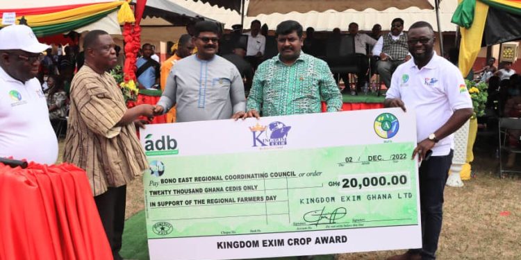 Dr. James Rajamani, CEO of Kingdom Exim Group supported by the Dr Emmanuel Rajamani (MD) presenting a dummy cheque to the Bono East Regional Minister (In smock) during the 38 Regional farmers day in Atebubu