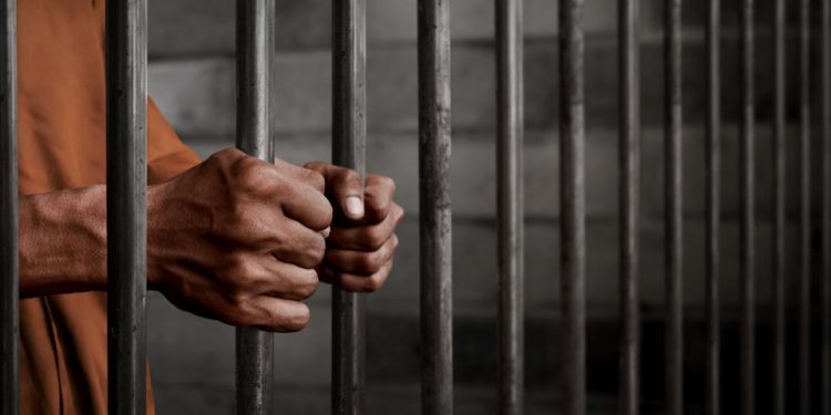 File image of a man behind bars