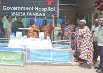 Representatives of the Wassa Dunkwa Traditional Council receiving the items from Fred Mensah Anyamesem, (4th from left), Northern Sector Manager, Republic Bank