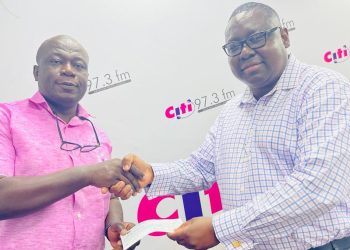 Mr Agyemang (right) presenting the cheque to Omane Mensah-Bonsu, Business Development Manager, Citi FM/Citi TV