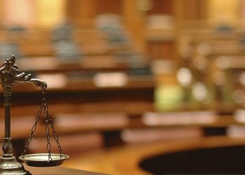 Symbol of law and justice in the empty courtroom, law and justice concept.