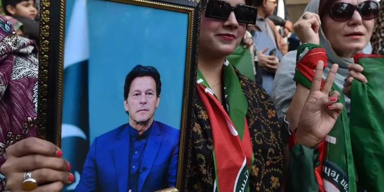 Supporters of Imran Khan's party attend a rally ahead of the general elections in Karachi
