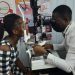 Dr Ampiah examining a patient's eye