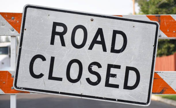 Horizontal shot of a road closed sign.
