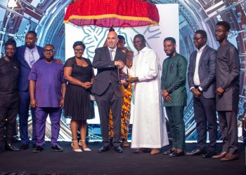 MD of Nestlé Ghana Ltd. with other leaders of the company, receiving the overall industry Award from the Finance Minister, Mohammed Amin Adams