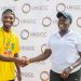Adjoba Kyiamah, Executive Director of the UK-Ghana Chamber of Commerce, congratulates a winner at the event
