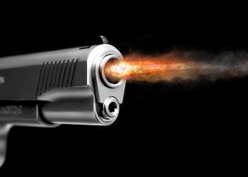 A fire from the gun after the shot. Gunshot