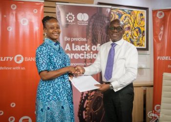 Ms. Constance Elizabeth Swaniker, Founder and President of DTI, and Kwabena Boateng, Deputy Managing Director, Wholesale Banking, holding the signed MoU