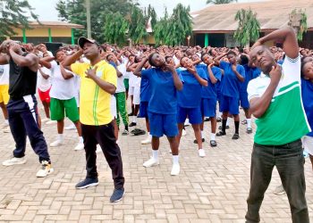 L-R: Mr Charles Gasman Instructor from National sports Authority, Headmaster of Obiri Yeboah SHS and some of the students displaying their skills at the school premises