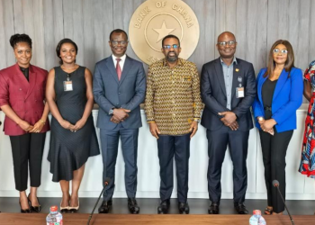 Dr. (Med) Baidoo (3rd from right) in a group picture with the Governor, Dr. Asiama (4th from right) and members of his management team after the meeting. Also in the picture is Dr. Ibrahim Akwasi Asante-Manu, a member of the KATH Board who accompanied the CEO to the meeting.
