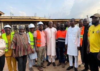 Member of Parliament for Asawase and Minister for the Interior, Alhaji Mohammed Muntaka Mubarak with site contractors.