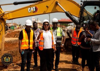 The Eastern Regional Minister (M) inspecting the road under construction