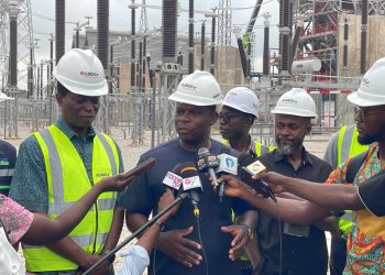 Deputy Minister for Energy and Green Transition, Richard Gyan Mensah in black