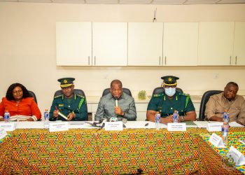 Chairman of the Governing Council of the Ghana Immigration Service (GIS), Rev. Stephen Wengam (M) flanked by some members of the GIS