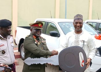 NACOC Official with Minister for the Interior, Mohammed Muntaka Mubarak,