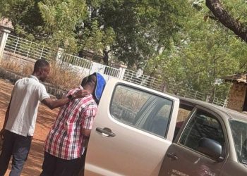 The suspect with coloured shirt